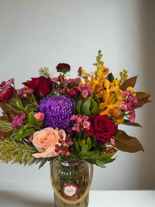 Colorful flower arrangement in a vase.