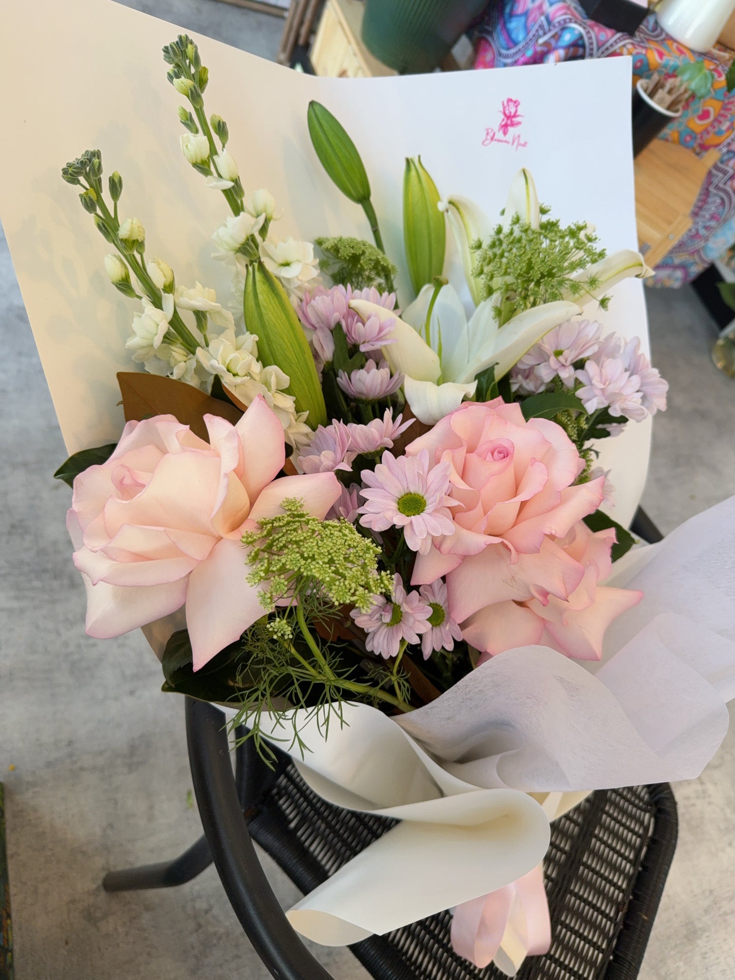 Bouquet of flowers with pink roses and white accent flowers