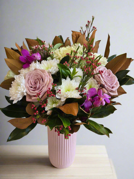 Bouquet of flowers with a pink vase