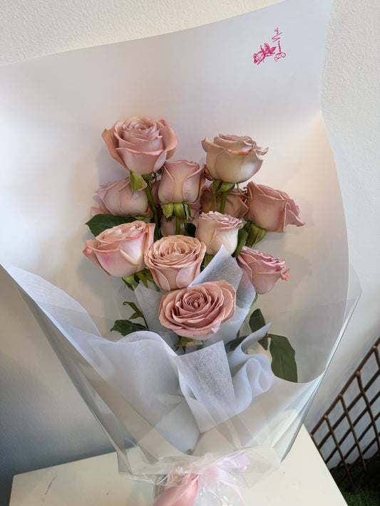 Bouquet of imported Mocha roses wrapped in white wrapping.